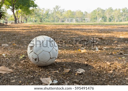 Old soccer ball on the field of rural Thailand