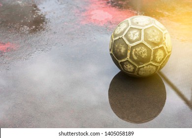 An Old Soccer Ball Stadium Wet.