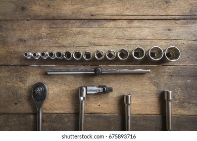 Old Socket Wrench Set On Wood Background,Select Focus,top View
