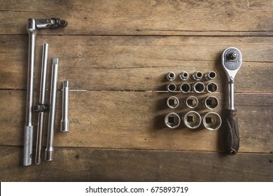 Old Socket Wrench Set On Wood Background,Select Focus,top View