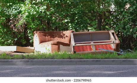 Old Sofa and Household Furniture Dumped on the Street Prepared for Bulk Item Curbside Pickup Collection by City Cleaning Services - Shutterstock ID 2206798965