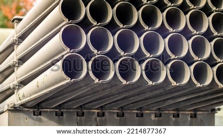 The old Soviet BM-21 Grad multiple launch rocket system on the chassis of a Ural-375D truck. MLRS 9K51 caliber 122 mm close-up, rear fragment. Artillery mount of 40 empty tubular rails
