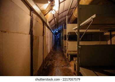 Old Soviet Bomb Shelter. Sheltering Room With Wooden Double-decker Beds
