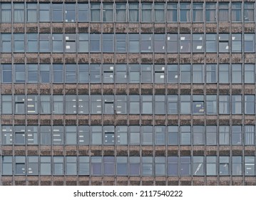 Old Soviet Building Brutalism Style. Lots Of Windows And Floors. Administrative Or Office Building. Texture, Window Pattern.