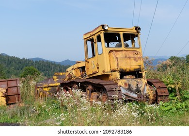 Old Soviet bulldozer abandoned in a field