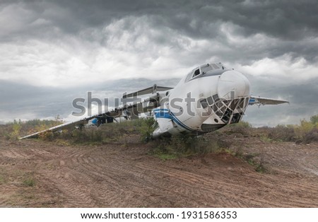 Old Soviet cargo plane IL-76 on the ground in cloudy weather. High quality photo