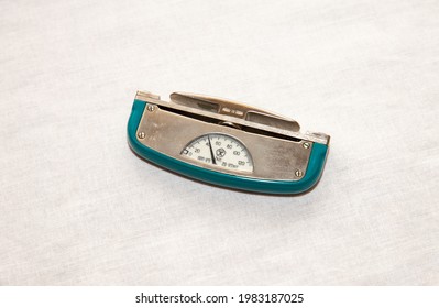 Old soviet dynamometer for measuring hand strength. Made in the USSR. On the white background