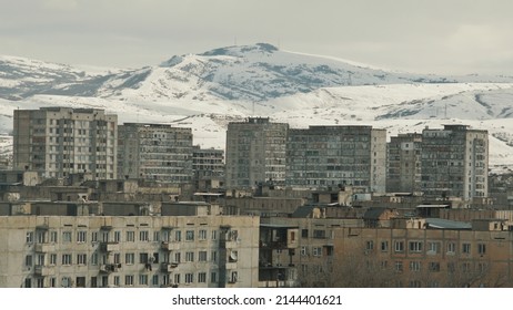 Old Soviet houses on the background of a mountain in the city of Tbilisi. Rokkor x 135mm lens, f2.8