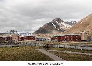 Old Soviet settlement Pyramiden in Spitzbergen, Svalbard. Red residential houses. Abandoned coal mining town.