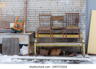 Old Soviet wooden chairs on the street in Russia.