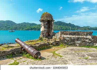 Old Spanish cannon at the fortress ruin of Santiago with a view over the Caribbean Sea in Portobelo near Colon, Panama, Central America.