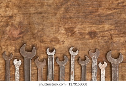 Old Spanners On Oily Rag Texture Background
