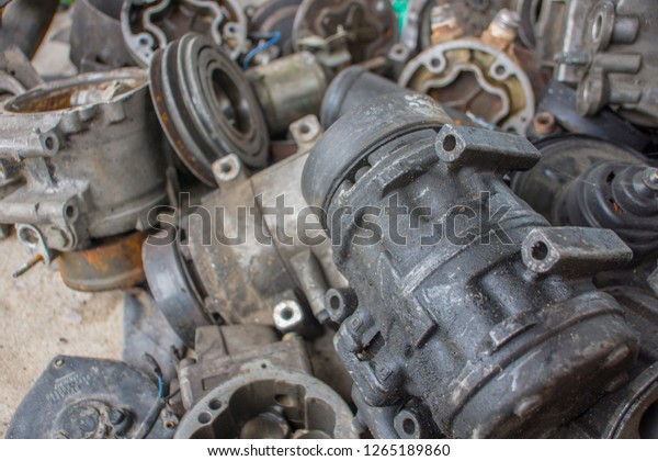 Old spare parts, cars in the car garage That has\
been removed