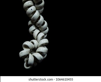 Old spiral telephone cable with black background