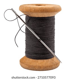 Old spool of thread and needle on a white background. Sewing accessories