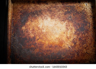 Old Stained Vintage Empty Metal Tray Background Texture For Oven Baking Or Cooking In A Close Up View From Overhead