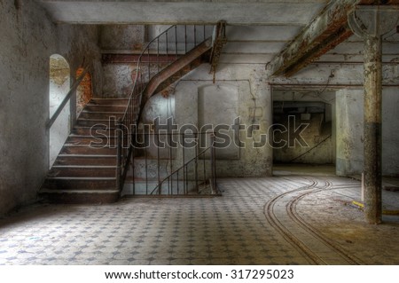 Old staircase in an abandoned factory and tracks