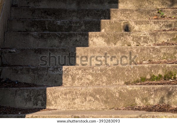 Old\
stairs in shadow and light\
Old stairs in an abandoned house,\
diagonally divided into a light and shady\
part.\
