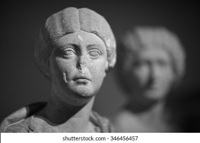 Old Statue Of Young Lady With Broken Nose