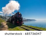 The old steam locomotive is driving along the Circum-Baikal Railway