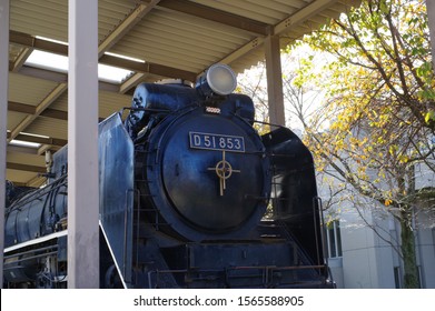 Old steam locomotive on display at the park.
