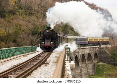 Old Steam Train On Old Stone Bridge Over Big River