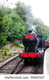 Old steam train waiting on the platform