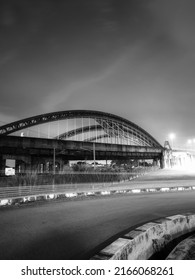 An Old  Steel Arch Bridge Over The Railway Track 