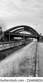 An Old  Steel Arch Bridge Over The Railway Track 