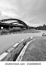 An Old  Steel Arch Bridge Over The Railway Track 