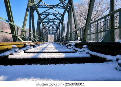 old steel railway bridge in winter

