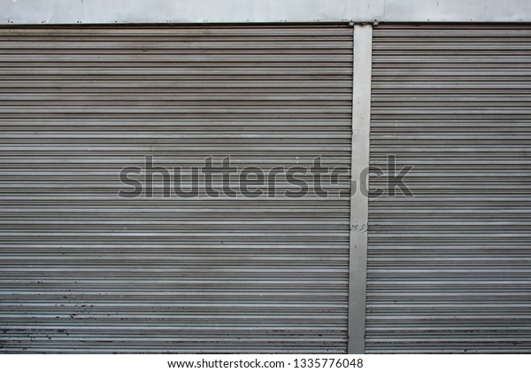 Old Steel roller\
shutter doors closed.