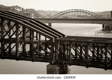 An Old Steel Train Bridge Crossing A River. Taken In Pittsburgh, PA.