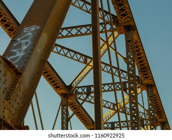 An Old Steel Train Bridge In Tempe, Arizona Reflects The Colors Of The Environment In These Images Of A Photographer's Perspective Looking Up At The Decorative Metal