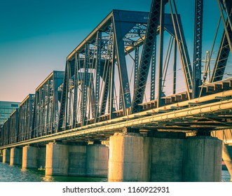 An Old Steel Train Bridge In Tempe, Arizona Reflects The Colors Of The Environment In These Images Of A Photographer's Perspective Looking Up At The Decorative Metal