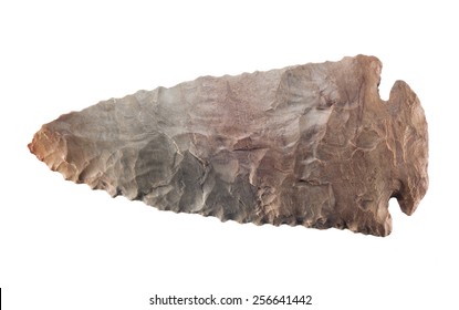 An old stone arrow head isolated on white.