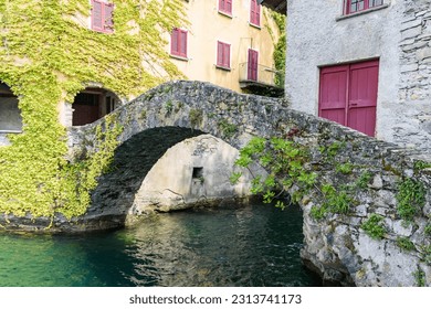 Old stone bridge at Nesso on  Como Lake - Shutterstock ID 2313741173