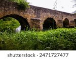 Old, stone bridge passing over Dobra river, famous for its arches, located in the Karlovac region, Croatia