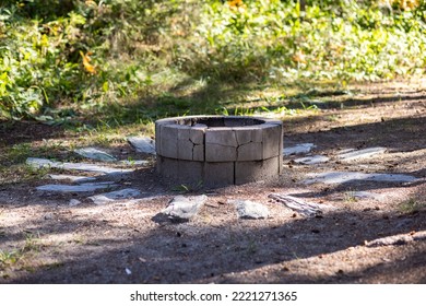 Old Stone Fire Pit Outside In A Forest. Cracked Fire Pit In The Woods.