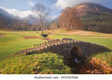 An Old Stone Footbridge Over A Stream At A Public Golf Course Near Ballachulish, At Glencoe In The Scottish Highlands.