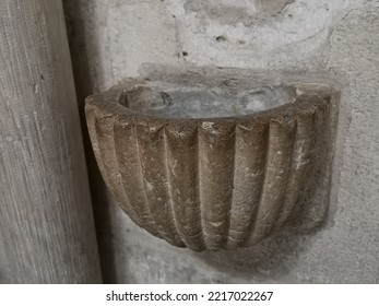 Old Stone Holy Water Font In A French Church.