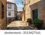 Old stone houses in narrow alleys in the old village of Castro Caldelas, Ribeira Sacra, Galicia.