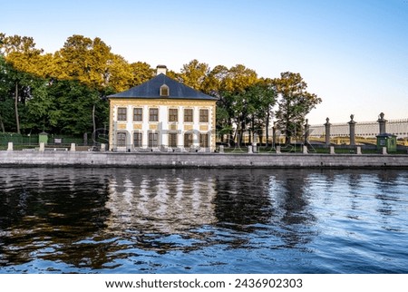 An old stone mansion on the riverbank.