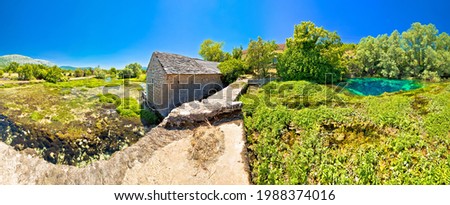 Old stone mill ruins on Cetina river source panoramic view, Dalmatian Zagora region of Croatia