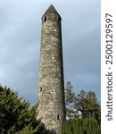 Old Stone round tower built in the 6th century in Glendalough valley, County Wicklow, Ireland