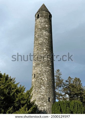 Old Stone round tower built in the 6th century in Glendalough valley, County Wicklow, Ireland