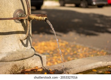 Old Stone And Sculpted Metal Public Drinking Water Fountain. European City, Summer Day, Close Up Shot, No People.