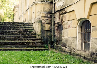 Old stone stairs to the castle overgrown with moss