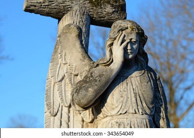 The Old Stone Statue Of An Angel Headstone In The Cemetery 