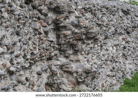Old stone wall texture with rough rocks